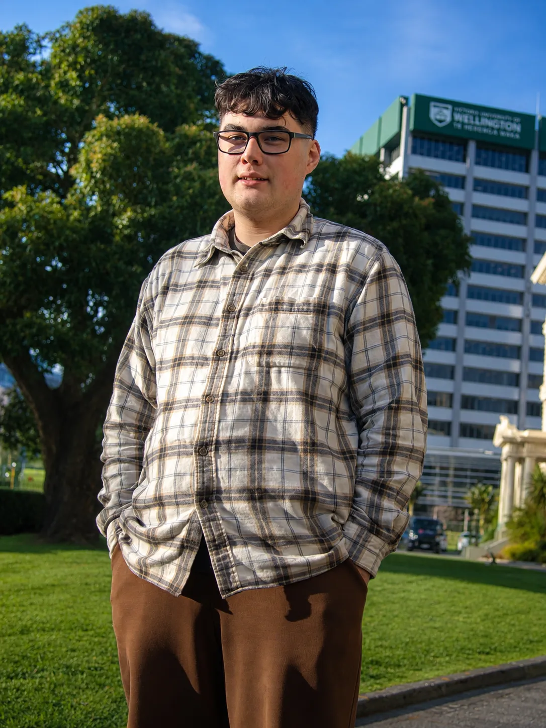 Photo of Arie with international students outside the Hub.